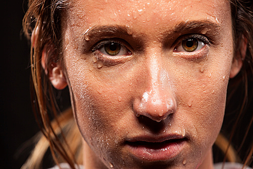 Woman with sweat on face